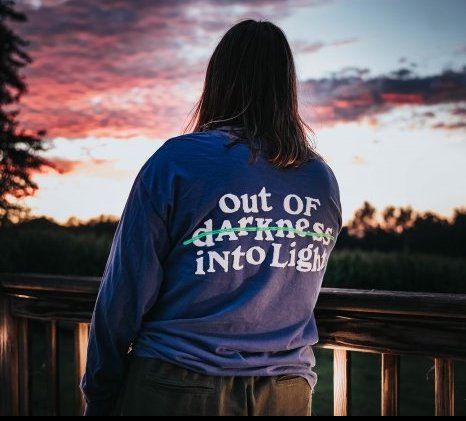 A woman looking at the sunset